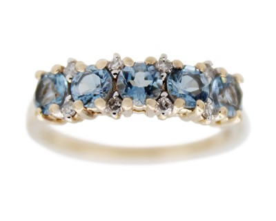 Lot 57 - A 9k gold five-stone aquamarine and diamond ring.