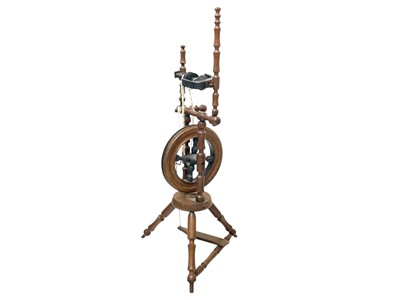 Lot 35 - An oak and elm spinning wheel.