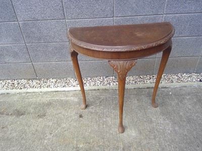 Lot 62 - A Demi-lune Table. The Table is 74cm tall,...