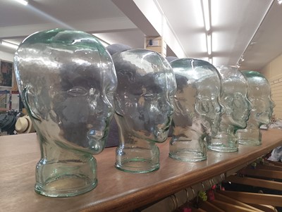 Lot 388 - Five Glass Hat Display Heads