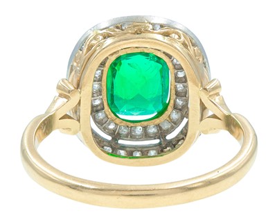 Lot 175 - An exquisite 18k gold Colombian emerald (appraised) and diamond double row halo ring.