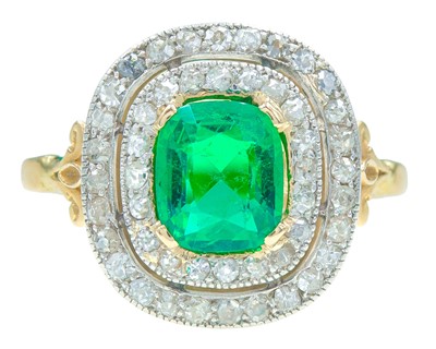 Lot 175 - An exquisite 18k gold Colombian emerald (appraised) and diamond double row halo ring.