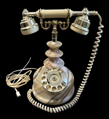 Lot 52 - An onyx rotary telephone, height 32cm.