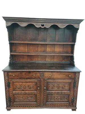Lot 790 - An oak dresser and rack.