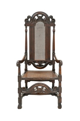 Lot 914 - A Charles II Oak and cane open armchair.