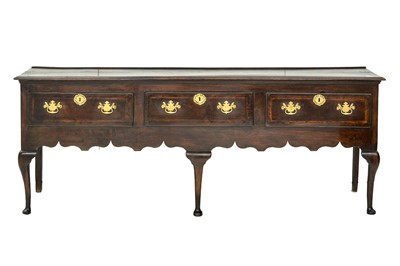 Lot 867 - An 18th century oak low dresser.
