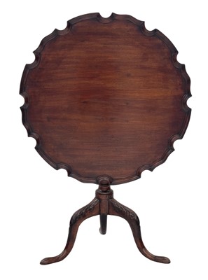 Lot 847 - A George III mahogany piecrust tilt top table.