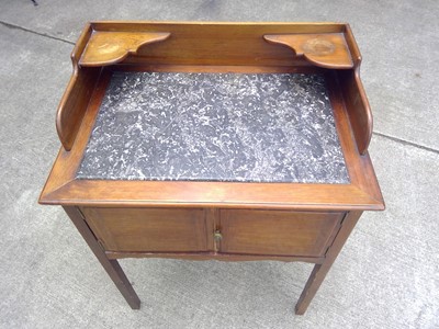Lot 91 - A Mahogany Washstand with a Marble Top. The...