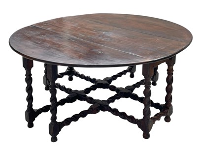 Lot 871 - An oak gateleg dining table of generous proportions.