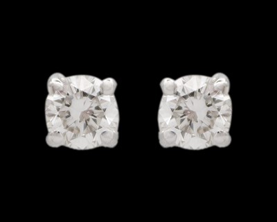 Lot 72 - A fine pair of 18k white gold solitaire 0.40ct diamond stud earrings.