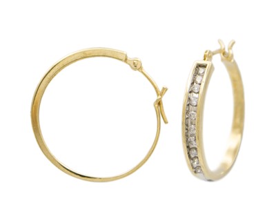 Lot 107 - A pair of 9k yellow and white gold diamond set hoop earrings.