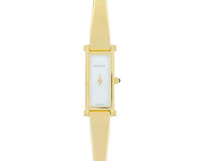 Lot 1020 - GUCCI - A gold-plated lady's quartz bracelet wristwatch.