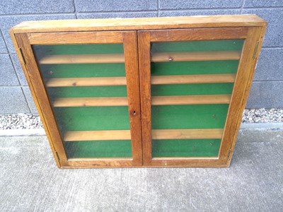 Lot 27 - An Oak Display Cabinet. The Cabinet measures...