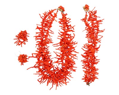 Lot 12 - A red coral necklace and matching bracelet, with a pair of clip-on earrings.