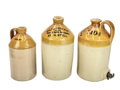 Lot 400 - Three St Austell brewery flagons.