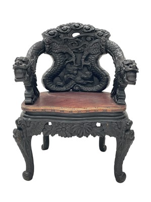 Lot 528 - A Chinese ornate black lacquered export open armchair.