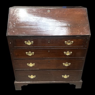 Lot 44 - An antique oak writing bureau, with quality...