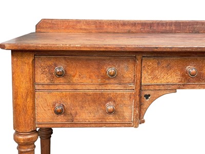 Lot 908 - A Holland & Sons oak writing or side table.