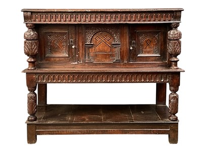 Lot 880 - An oak two tiered court cupboard.