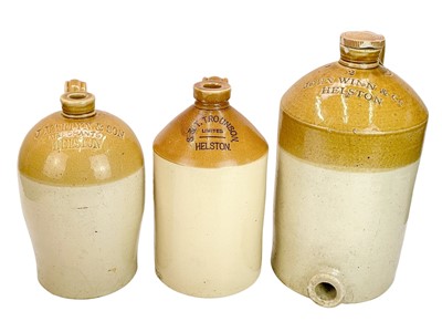 Lot 370 - Three Helston stoneware flagons.