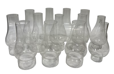 Lot 124 - A collection of glass oil lamp chimneys.