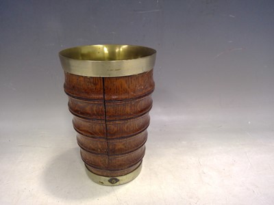 Lot 142 - An Oak and Silver Plate Drinking Vessel. The...
