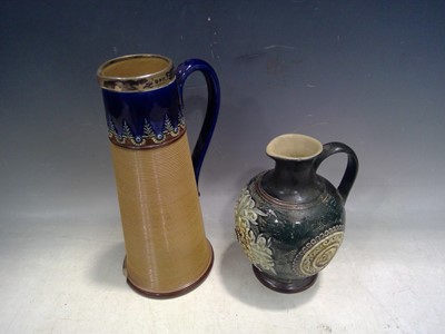 Lot 153 - Two Royal Doulton Lambeth Jugs. The Taller jug...
