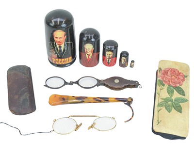 Lot 51 - A pair of tortoiseshell folding lorgnettes.