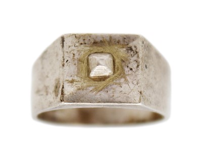 Lot 26 - A 9k gold, black onyx, and diamond signet ring, and a silver signet ring.