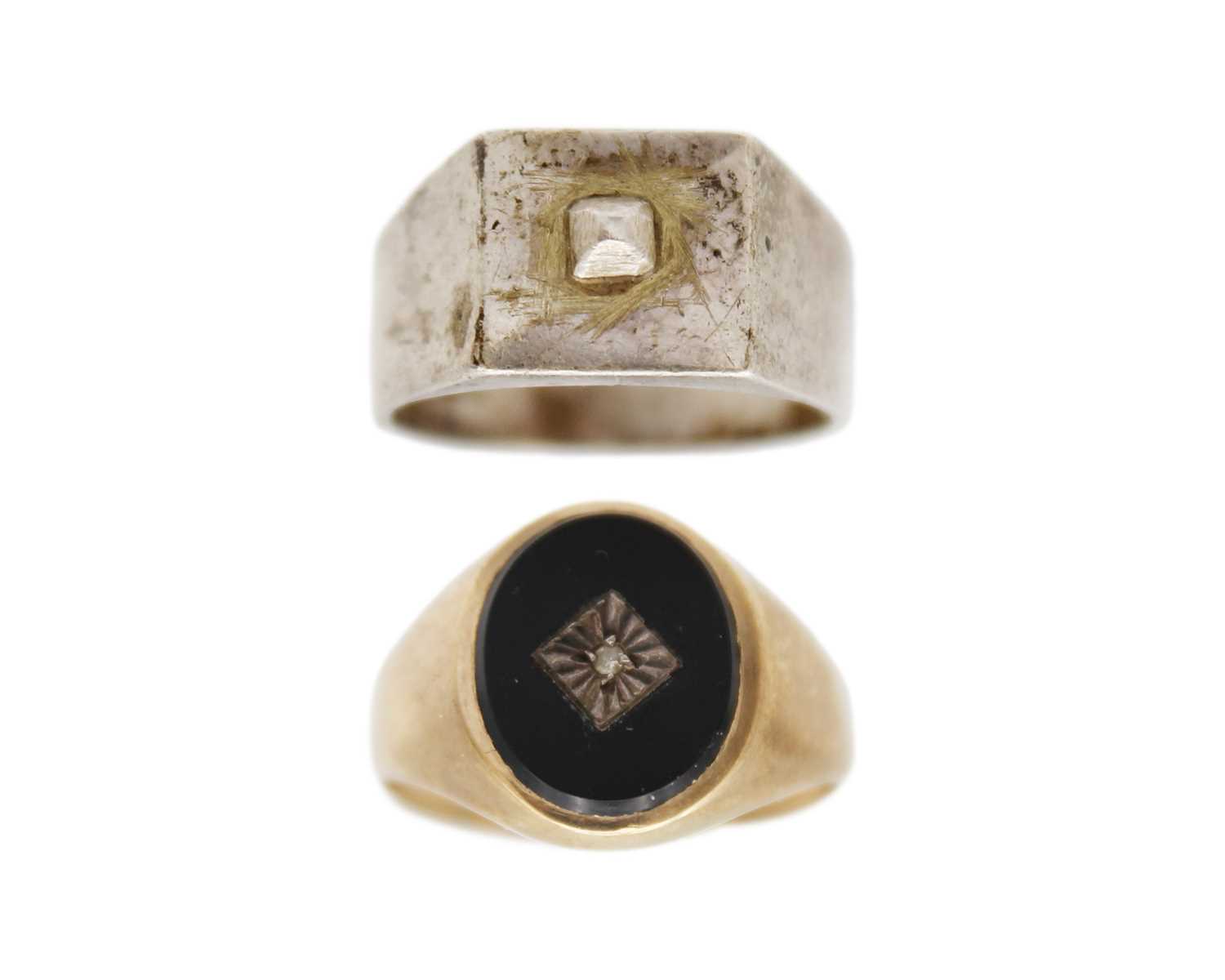 Lot 26 - A 9k gold, black onyx, and diamond signet ring, and a silver signet ring.