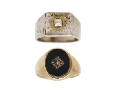 Lot 26 - A 9k gold, black onyx, and diamond signet ring, and a silver signet ring.