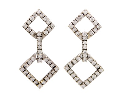 Lot 94 - An attractive 18k white gold and diamond set pendant and earring suite.