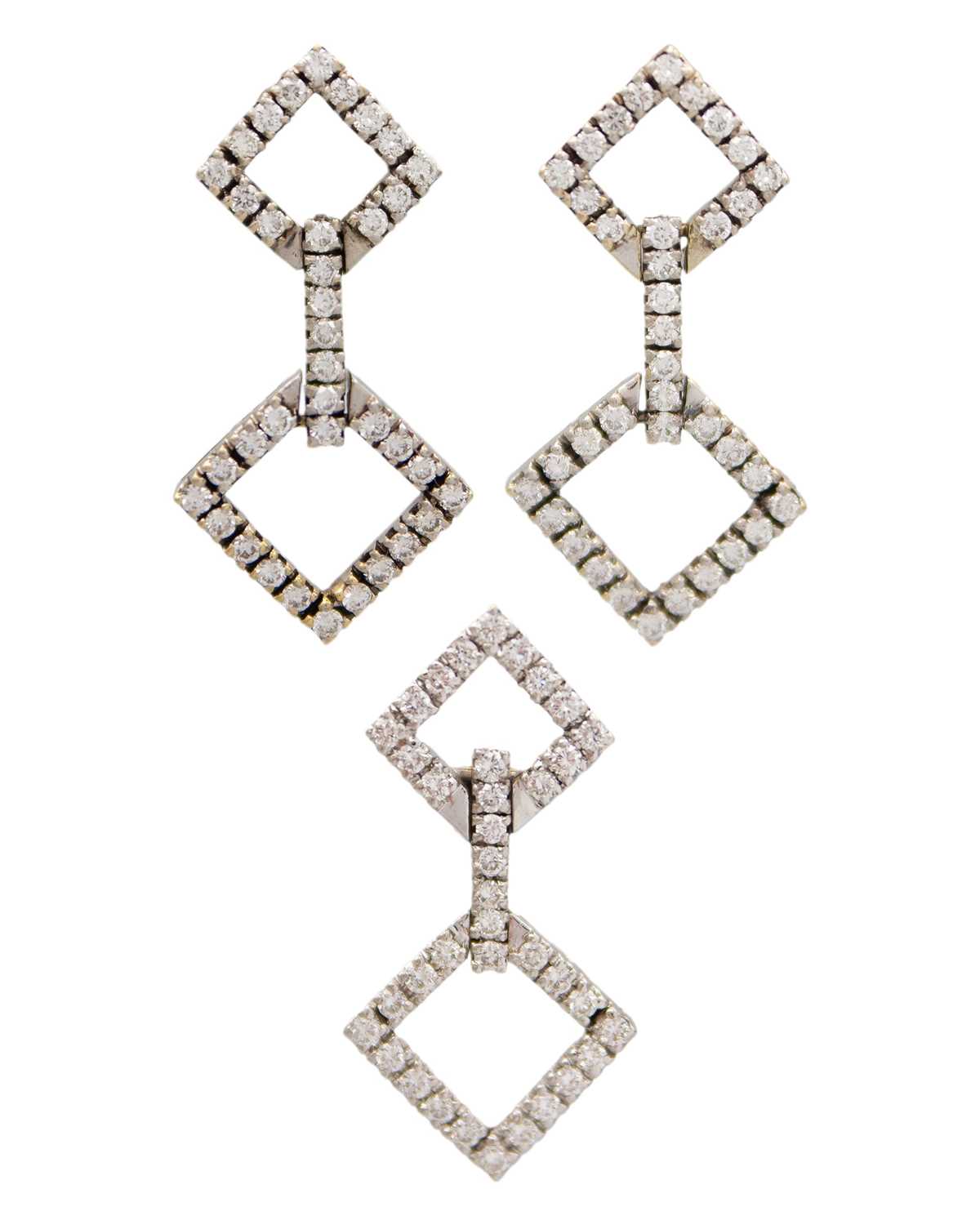 Lot 94 - An attractive 18k white gold and diamond set pendant and earring suite.