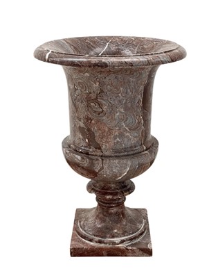 Lot 109 - A turned red striated marble urn.