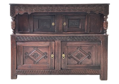 Lot 911 - An oak court cupboard.