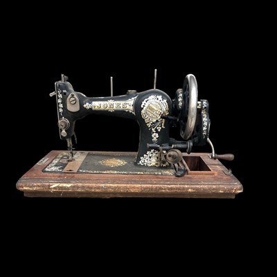 Lot 73 - A vintage Jones sewing machine.