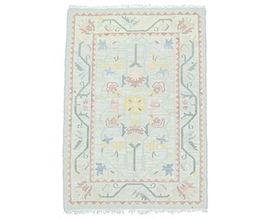 Lot 691 - A floral flatweave rug.