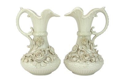 Lot 624 - A pair of Belleek 'Aberdeen' ewers.