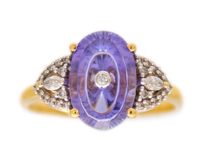 Lot 114 - GLENN LEHRER (1953-2024) - A TorusRing tanzanite and diamond 18k gold ring.