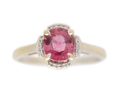 Lot 199 - LORIQUE - A Padparadscha sapphire and diamond 18k white gold ring.