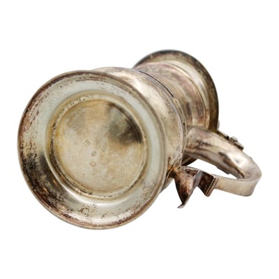 Lot 214 - A rare George II silver lidded tankard by Thomas Moore II.