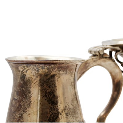 Lot 214 - A rare George II silver lidded tankard by Thomas Moore II.