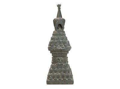 Lot 555 - A Nepalese carved wood stupa, circa 19th century.