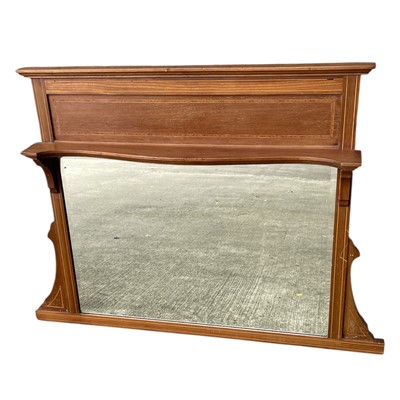 Lot 214 - An overmantel bevel-edged mirror with an...