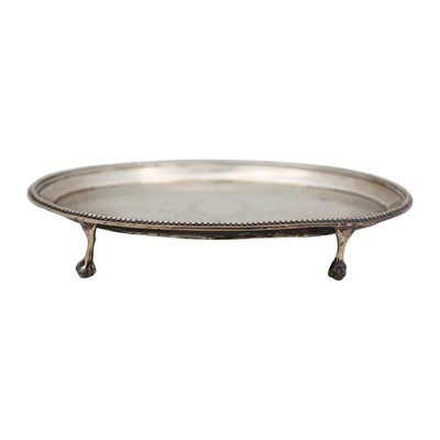 Lot 205 - A George III silver oval bright cut waiter by John Hutson.
