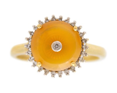 Lot 85 - GLENN LEHRER (1953-2024) - A TorusRing fire opal and diamond 10k gold halo ring.