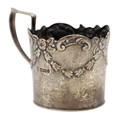 Lot 187 - An Edwardian silver cup holder by William Hutton & Son Ltd.