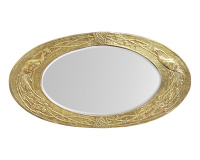 Lot 842 - An arts and crafts brass mirror.
