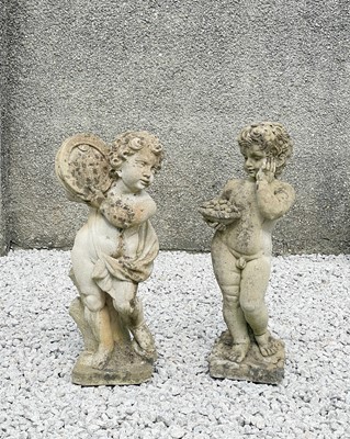 Lot 775 - Two reconstituted stone figures of putti.