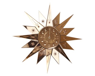 Lot 788 - A peach glass Art Deco sunburst wall clock.